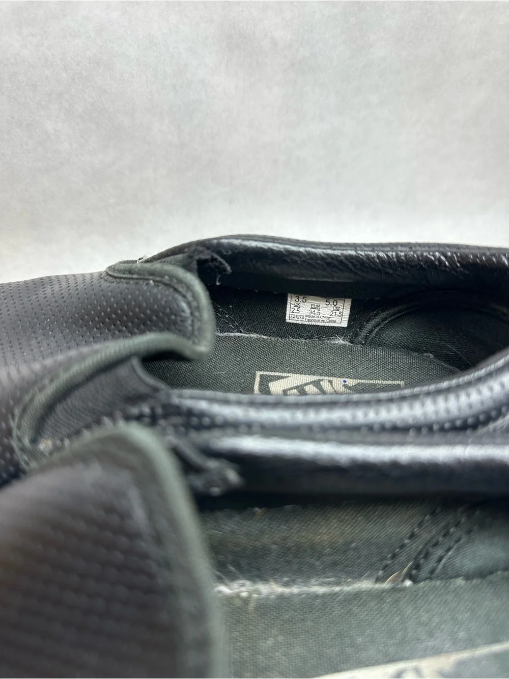Vans Black Perforated Leather Slip-On Sneakers
